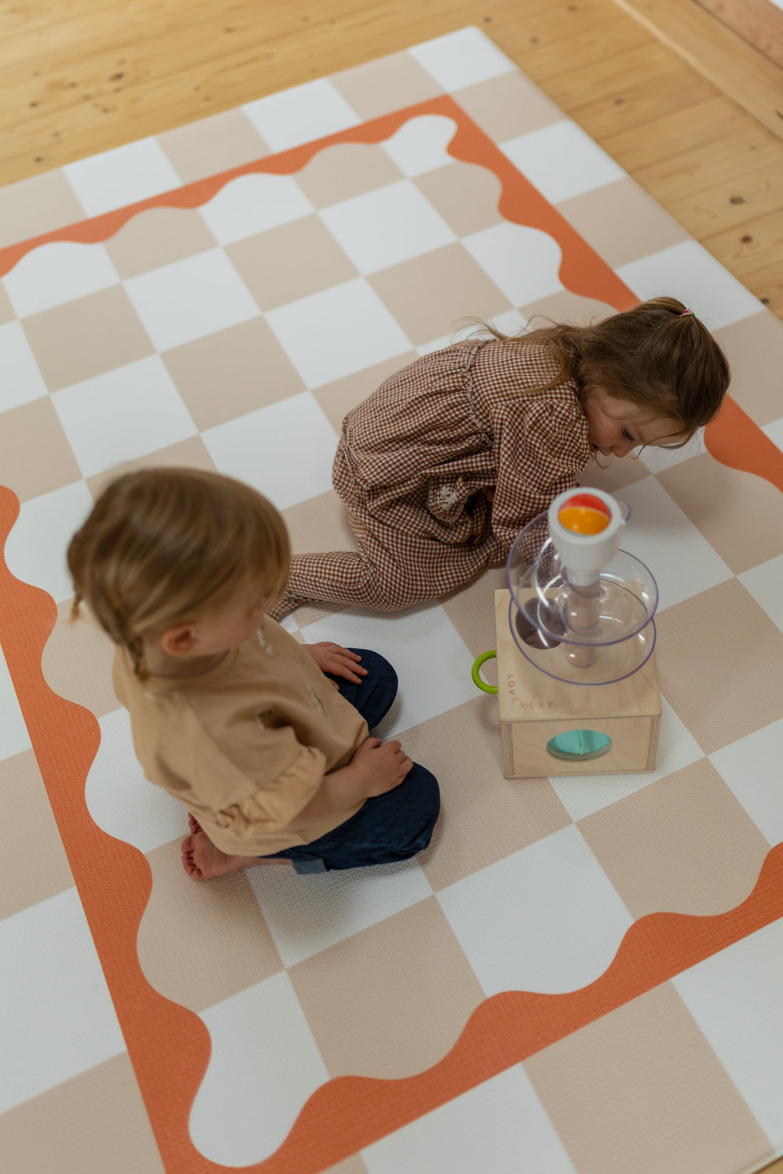 Children playing on Peach Gingham
