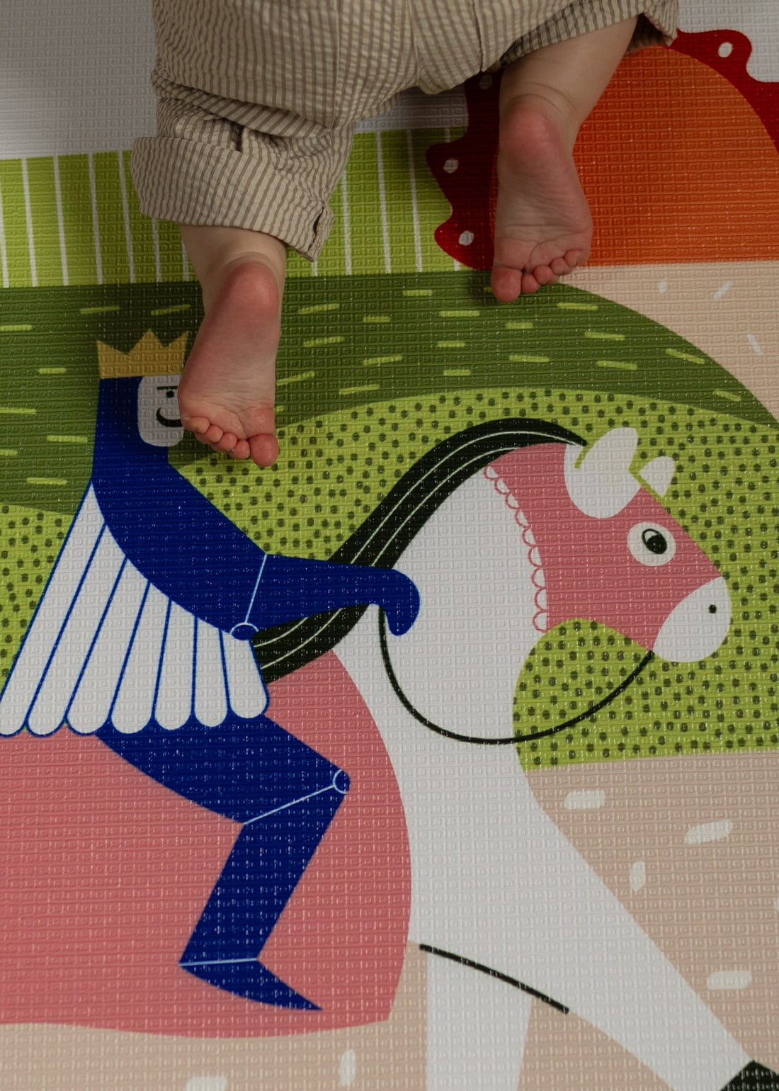 Baby on-the-move crawling on the playmat